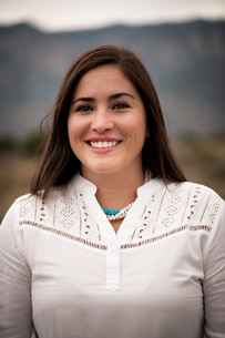 Myrriah Gomez, woman in white shirt and turquoise necklace