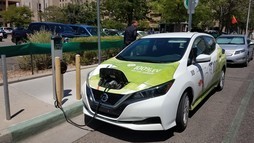 County EV hooked up to charger