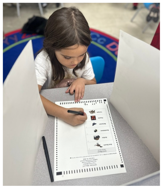 THRIVE student marking a ballot