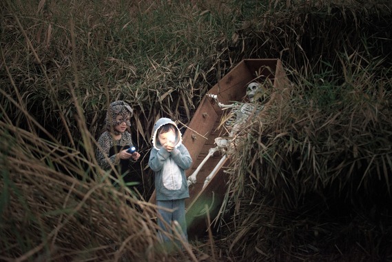 children in field of reeds at haunt the wetlands event