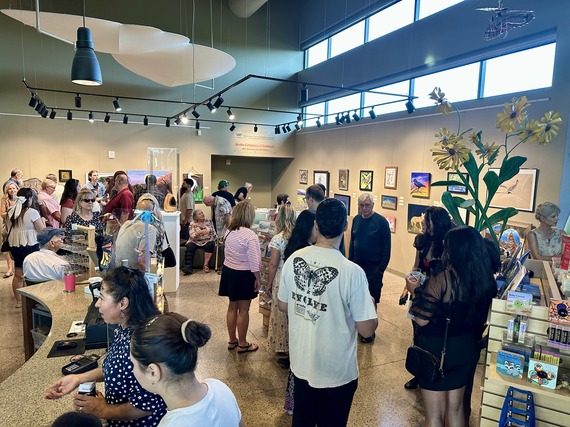 People attending the "In the Company of Animals" reception