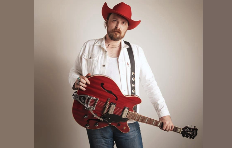 photo of Zach Ryan holding a guitar
