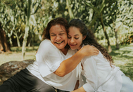 Mother and daughter hugging