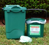 Food scraps recycling buckets and roll of compostable bags