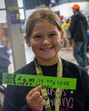 Girl holding sticker