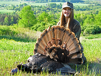 A youth hunter with her turkey harvest.