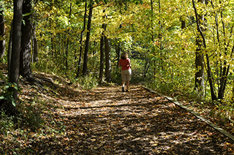 A woman walking on a trail
