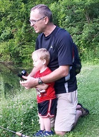 father and child fishing