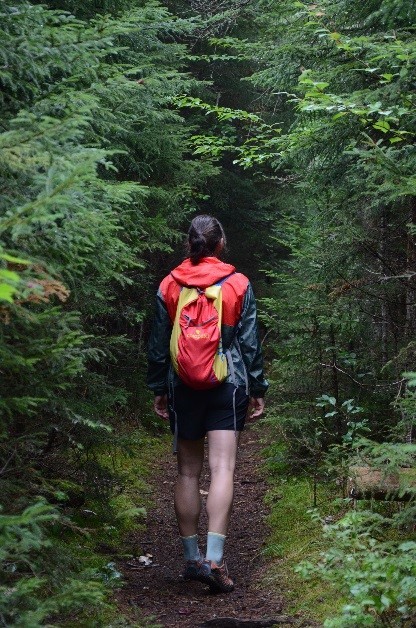 Girl hiking in the woods