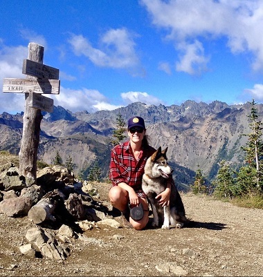 woman with dog on winter hike