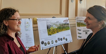 A Cornell landscape architecture student explains her resilient waterfront design concept to an interested resident.