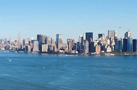New York Harbor with Manhattan skyline in the background.