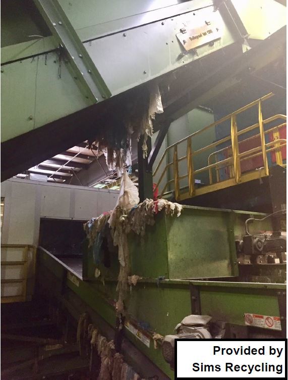image showing film plastics tangled around recycling facility equipment