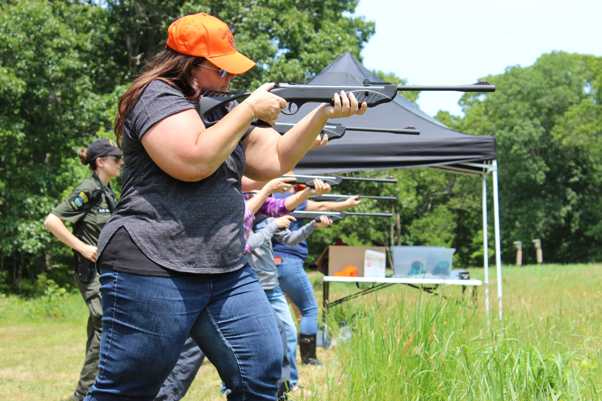 Women shooting firearms at a range