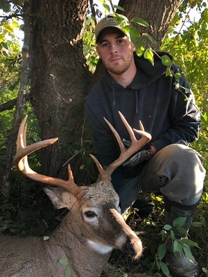 Hunter with a buck