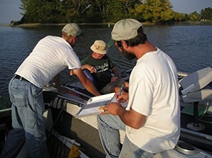 Staff surveying anger in another boat