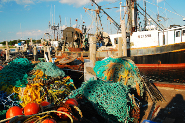 Commercial fishing vessel and gear at fishing dock