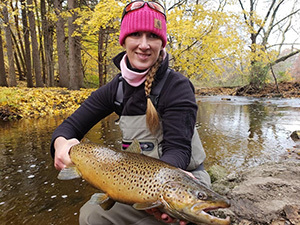 Angler with brown trout