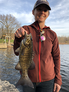 Angler with smallmouth bass
