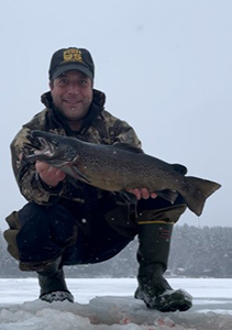Angler with landlocked salmon. 