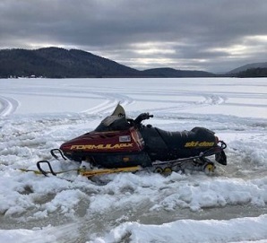 Snowmobile stuck on ice 