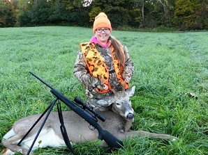 youth hunter with a harvested buck