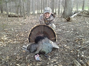 youth hunter with harvested turkey