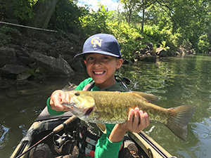 Angler with smallmouth bass