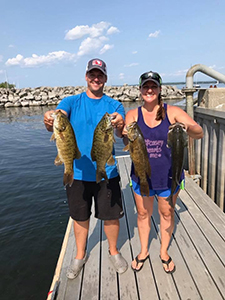 Couple fishing with bass