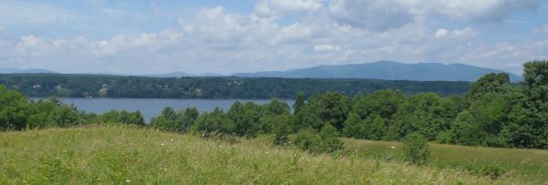 View of the Hudson River with mountains in the distance during the summer.