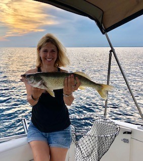 Angler with walleye on Lake Erie