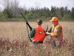 hunters in a field