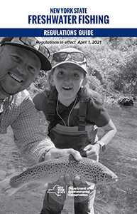 Cover of the Freshwater Fishing Regs guide with man and girl