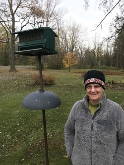 The 2021 Winner of the I Bird NY challenges standing next to their bird house