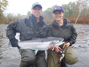 Two female anglers holding up catch