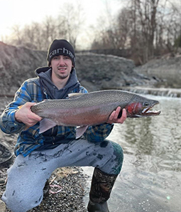 Angler with Lake Erie tributary steelhead 