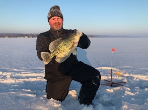 Angler holding up Crappie