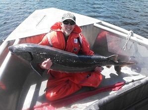 David Gordon holding up sturgeon