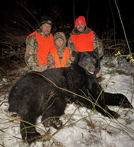Thomas Mecca Jr. (right) with his black bear taken in December 2021. Also pictured are Thomas' father Tom Mecca and nephew Mark Mecca Jr.