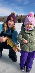 Michelle Poprawski with daughter ice fishing