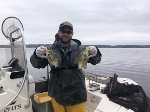 DEC staff holding up Saratoga Black Crappie
