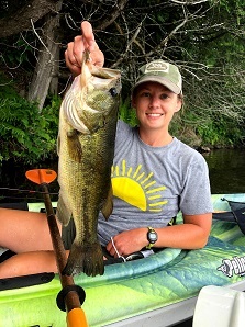 Female Angler holding up Largemouth Bass