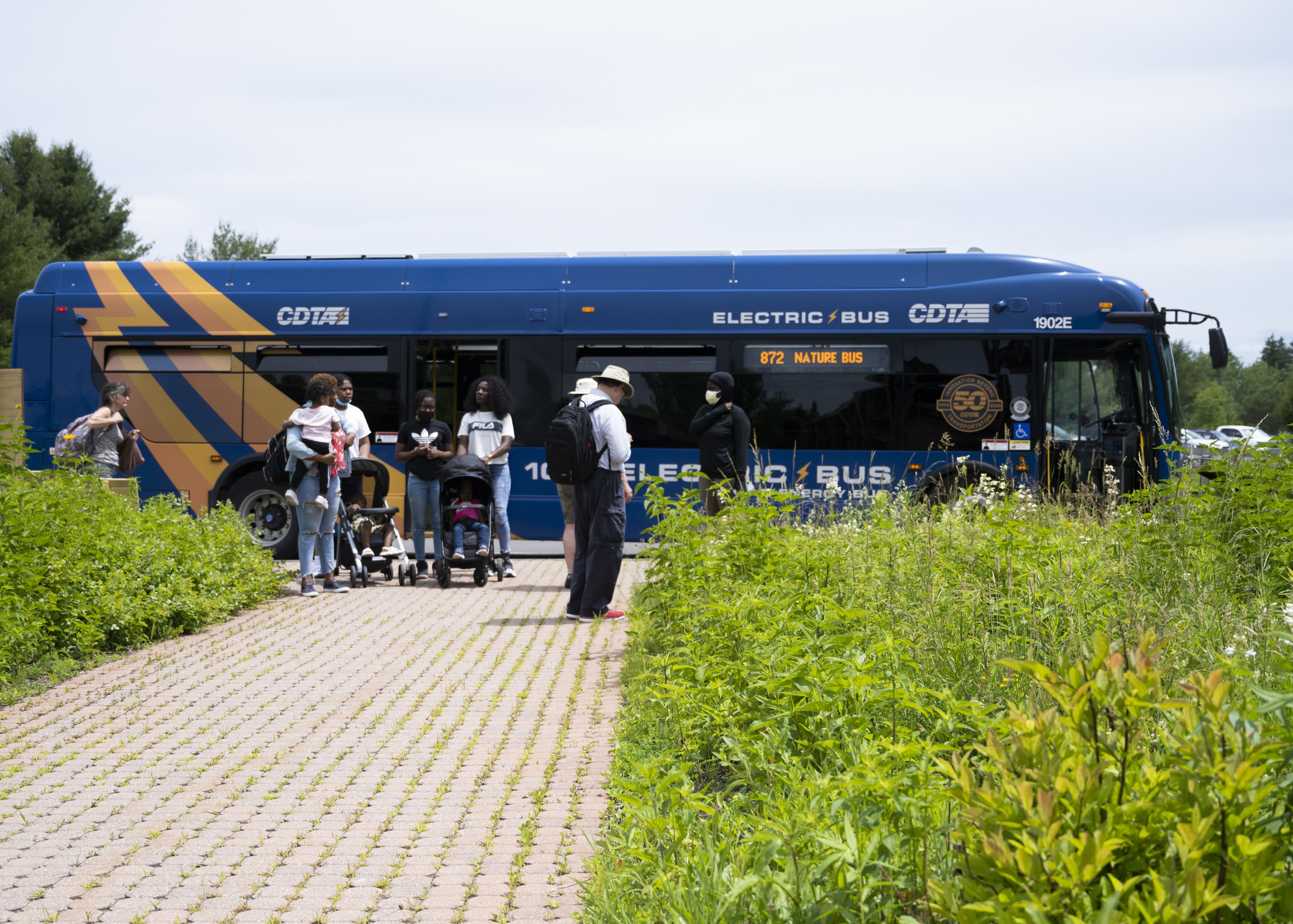a group of bus riders getting off the CDTA nature bus at five rivers environmental education center