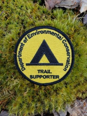 Circular yellow DEC trail supporter patch 