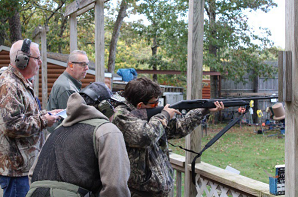 Youth Waterfowl Program: Boy displaying firearm safety 
