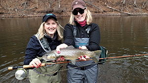 Anglers with brown trout