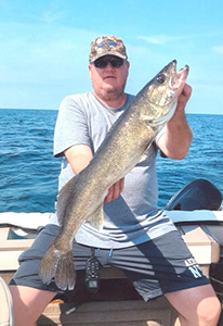 Angler with Lake Erie walleye