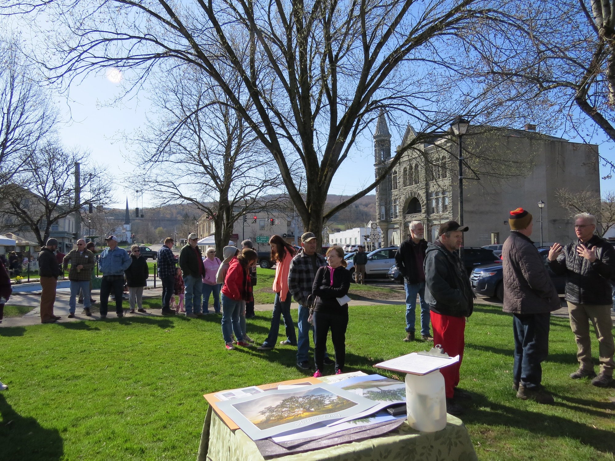 People lined up for a free tree sapling and poster at the 2022 Arbor Day Celebration in Oxford, NY