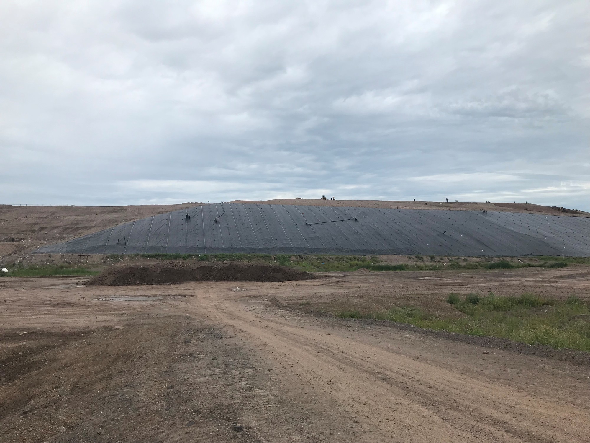 Exposed geomembrane cover over the east side slope of cell 12
