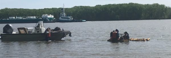 view of Hudson with tug and fishing boat